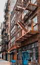 One Industrial old apartment facades, with fire stairs. Soho, Manhattan. NYC Royalty Free Stock Photo