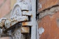 One iron gray rusty door hinge on an old chimney hatch Royalty Free Stock Photo