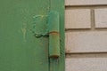 One iron green door hinge in rust Royalty Free Stock Photo