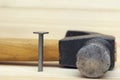 One iron nail and hammer Royalty Free Stock Photo