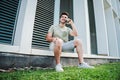 One isolated handsome man having a cell phone call with a friend. Happy male teenager talking using a smartphone. Young Royalty Free Stock Photo