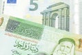 A one Jordanian dinar with a Euro note