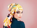 She is one of a kind. Studio portrait of a confident young woman wearing a colorful head scarf while posing against a Royalty Free Stock Photo