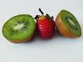 One strawberry and two half of kiwi Royalty Free Stock Photo