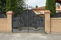 One large black metal gate with an iron wrought iron pattern Royalty Free Stock Photo