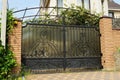 One large black metal gate with an iron wrought iron pattern Royalty Free Stock Photo