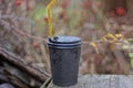 One large black paper cup with coffee closed with a plastic lid Royalty Free Stock Photo