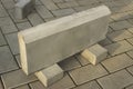 One large curb stone is made of concrete