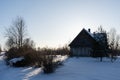 Large old wooden house stands in a white snowy Royalty Free Stock Photo