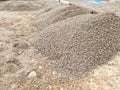 one large pile of gray rubble and small stones in the street road Royalty Free Stock Photo