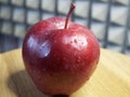 One large red apple. Water droplets on an apple peel. Apple of the Red Chief variety Royalty Free Stock Photo