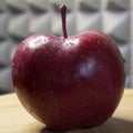 One large red apple. Water droplets on an apple peel. Apple of the Red Chief variety Royalty Free Stock Photo