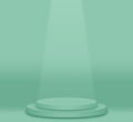 One layer green pastel color round pedestal podium and green background.The light shines down below.For place goods,cosmetic,