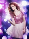 She is one with the light. a young woman dancing the night away in a beautiful dress. Royalty Free Stock Photo