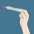 One line pregnancy test and hand