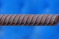 One long brown iron rod from rebar in rust Royalty Free Stock Photo