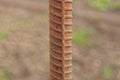 One long brown iron rod from rebar in rust Royalty Free Stock Photo