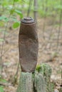 one long old brown rusty burnt metal can