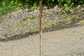 One long rusty iron rod brown rebar