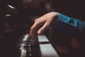 One male hand on the piano. The palm lies on the keys and plays the keyboard instrument in the music school. student learns to Royalty Free Stock Photo