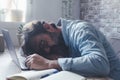 One man asleep on the laptop in home office workplace. Tired overwork people using computer and technology. Insomnia. Stress for Royalty Free Stock Photo