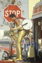 A one-man band in a gold lame costume