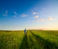 One man and field of summer grass Royalty Free Stock Photo