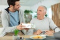 one man giving present to another man Royalty Free Stock Photo