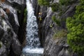 One man rappelling the Arado Waterfall cascata do arado in the Peneda Geres National Park Royalty Free Stock Photo