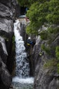 One man rappelling the Arado Waterfall in the Peneda Geres National Park, in Portugal
