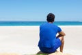 One man sitting alone at the beach Royalty Free Stock Photo