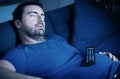 One man sleeping and snoring watching television Royalty Free Stock Photo