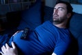 One man sleeping and snoring watching television Royalty Free Stock Photo