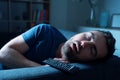 One man sleeping and snoring watching television Royalty Free Stock Photo