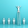 One man standing with arms wide open on top of ladder above other people Royalty Free Stock Photo
