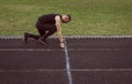One man on the start line awaits the start of the sprint. stadium, rubber track. athletics competitions. Track and field runner in Royalty Free Stock Photo