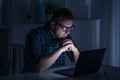 One man working late at night on computer Royalty Free Stock Photo