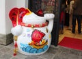 One maneki-neko (or lucky) japanese cat in front of one souvenir shop in Hong Kong