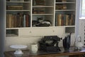 One of Ernest Hemingway`s six toe cats sleeping in his bookcase in his writing room.