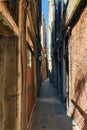 One of the many narrow streets of Venice on a Sunny summer day Royalty Free Stock Photo