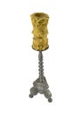 One metal candlestick with wax candle on top