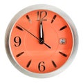 One minute to twelve o'clock on orange dial Royalty Free Stock Photo