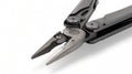 One modern gray iron open folding multifunctional knife on a white background. Multi-tool with advanced tools. Pliers