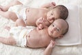 One month newborn twin babies resting on bed- close up top viewpoint shot