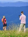 One more shot. Travel together with darling. Couple taking photo. Couple in love hiking mountains. Lets take photo Royalty Free Stock Photo