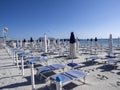 Morning empty beach with parasols, Sardinia, Italy