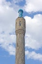 One mosque minaret tower isolated on sky backgroun