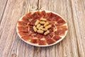 One of the most popular Spanish tapas of all time. A good plate of Iberian ham well cut by a specialist in the matter Royalty Free Stock Photo