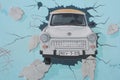 One of the most symbolic pieces of graffiti the Berlin Wall has to offer, Trabant car breaking through the concrete