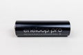 One new AA Panasonic Eneloop rechargeable black AA battery on a light background. October 16, 2022 Balti Moldova.